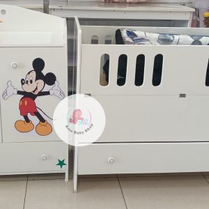 Baby cot with storage drawers