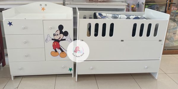 Baby cot with storage drawers