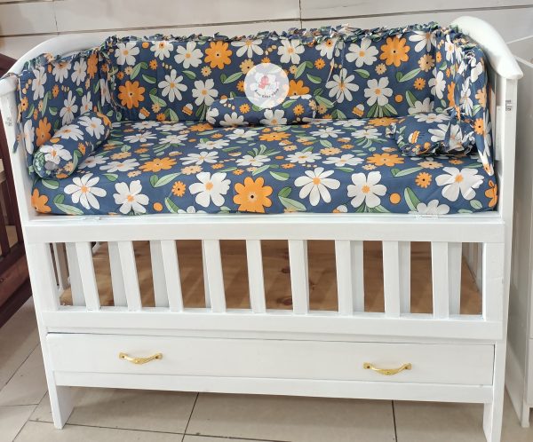 Baby cot bumper with matching bedsheet, head pillow and 2 side pillows. Bumper goes round the cot preventing the baby from knocking on to the sides or legs getting trapped between the cot straps. Also blocks wind ensuring a warm environment for your little one. Prints mat vary depending on availability.